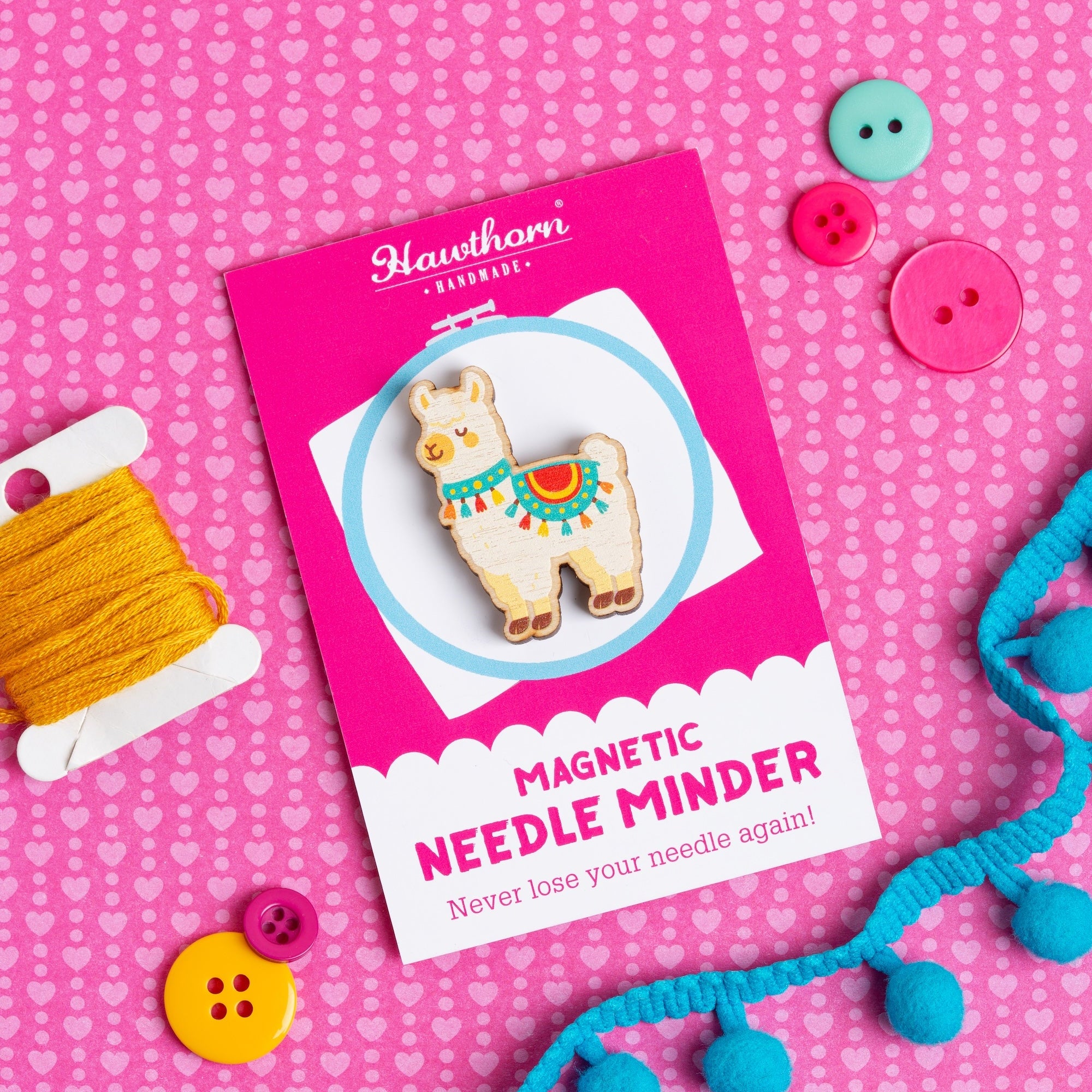 Hawthorn Handmade Alpaca magnetic needle minder on a pink background