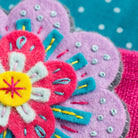 Close up of Beatrix flower brooch.