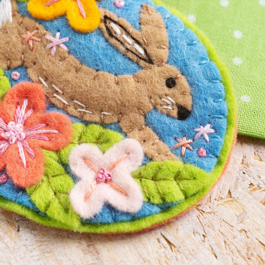 Close up image of hare felt craft brooch.