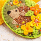 Close up image of hedgehog felt craft brooch kit