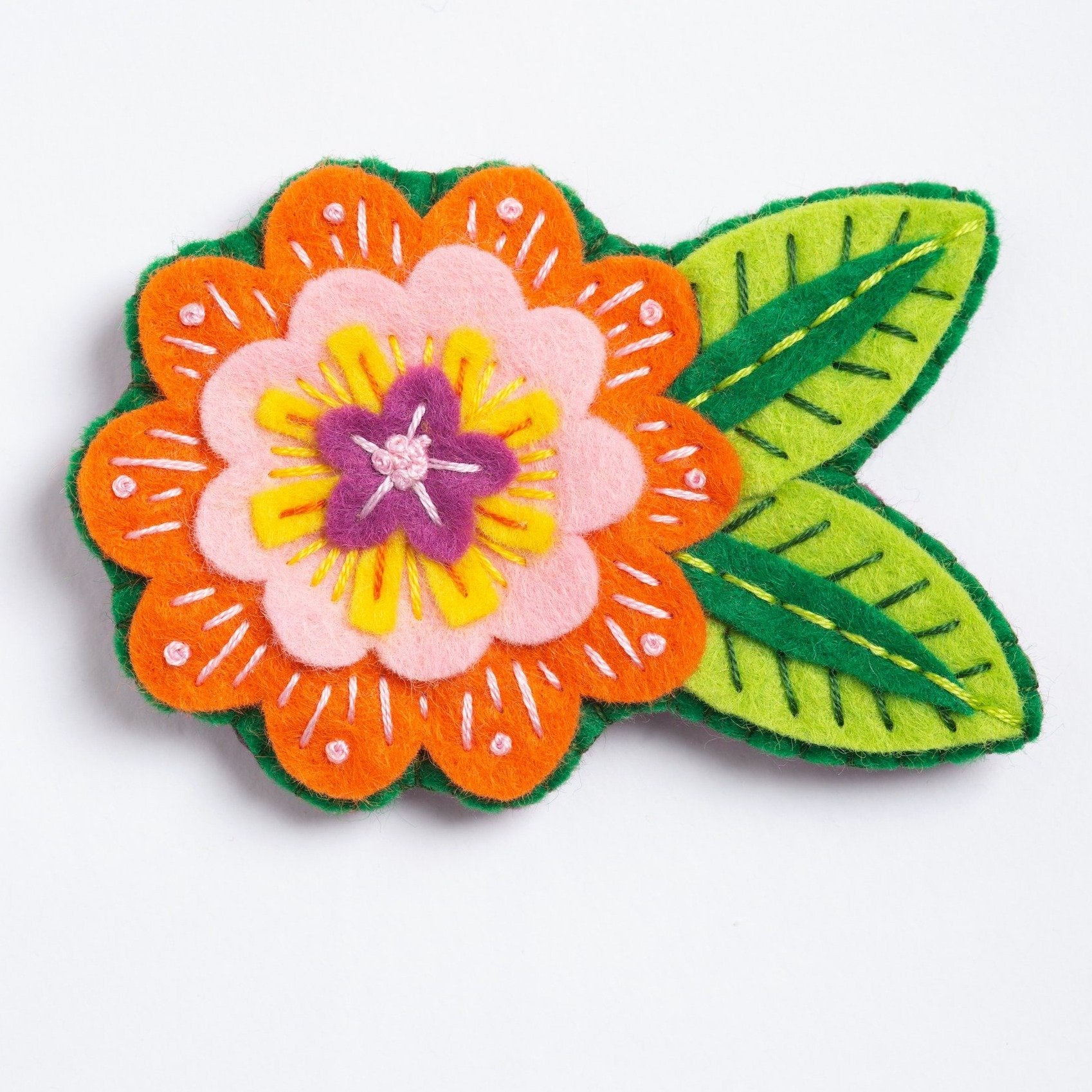 Clipped image of margery flower brooch on white background