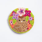 Clipped image of tawny owl brooch on white background.