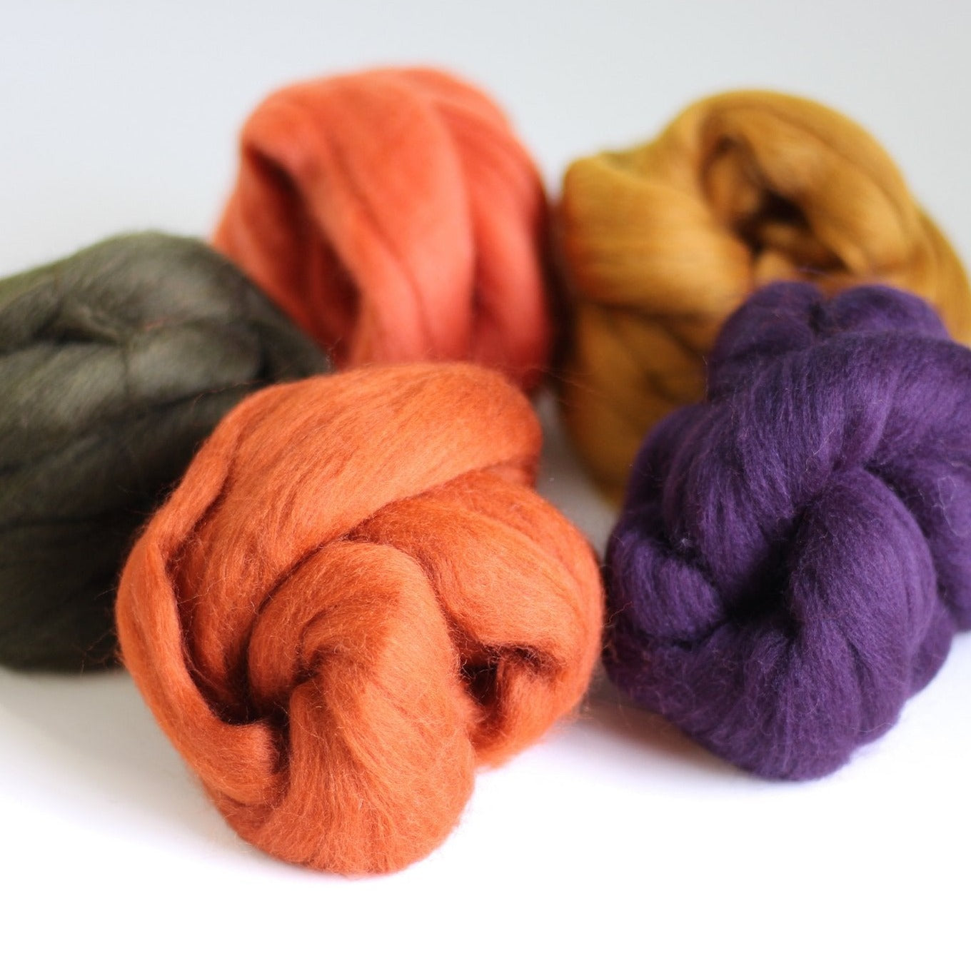 Autumn wool bundle from another angle on a white background.