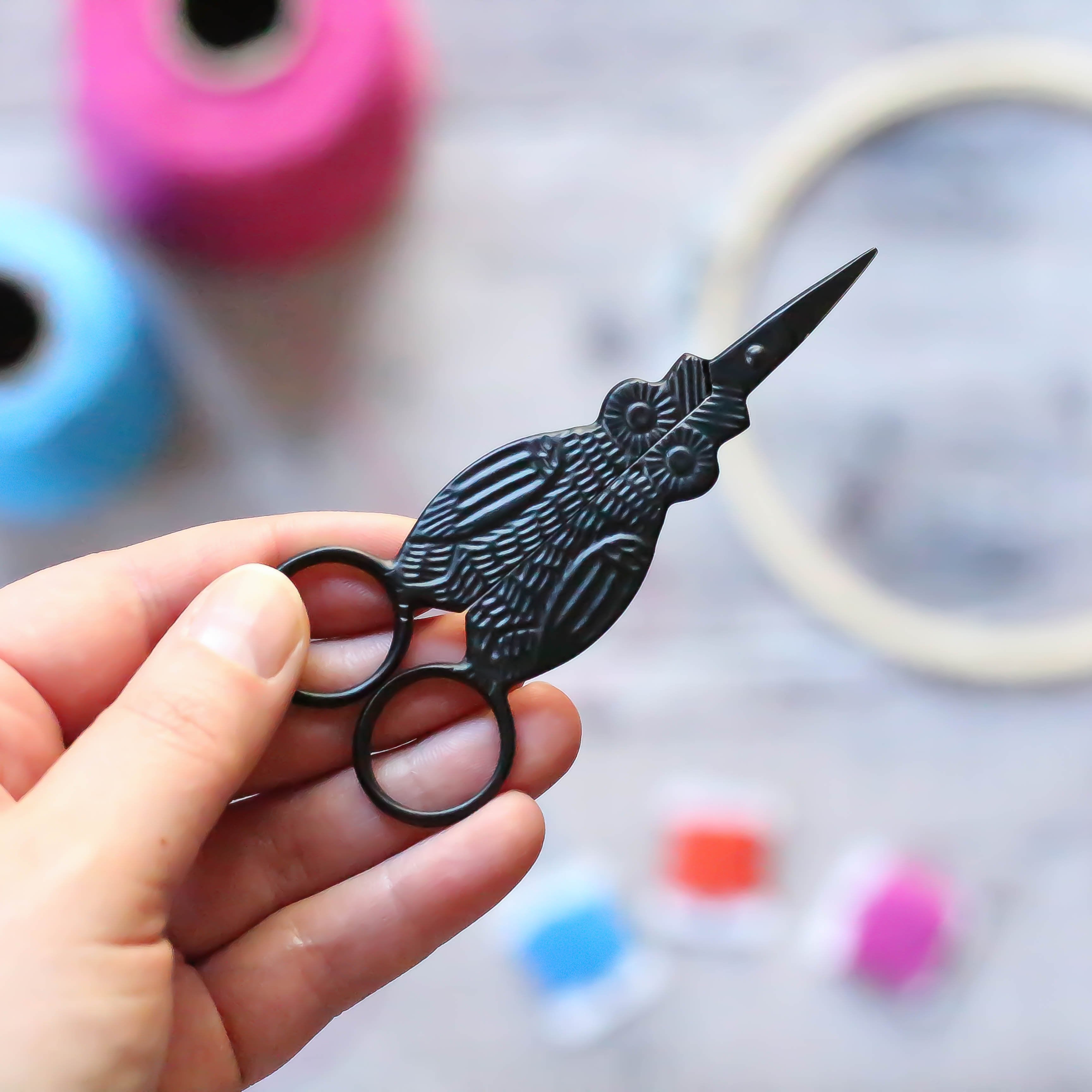 Black Owl Embroidery Scissors in hand