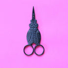 Black Owl Embroidery Scissors closed on flat background