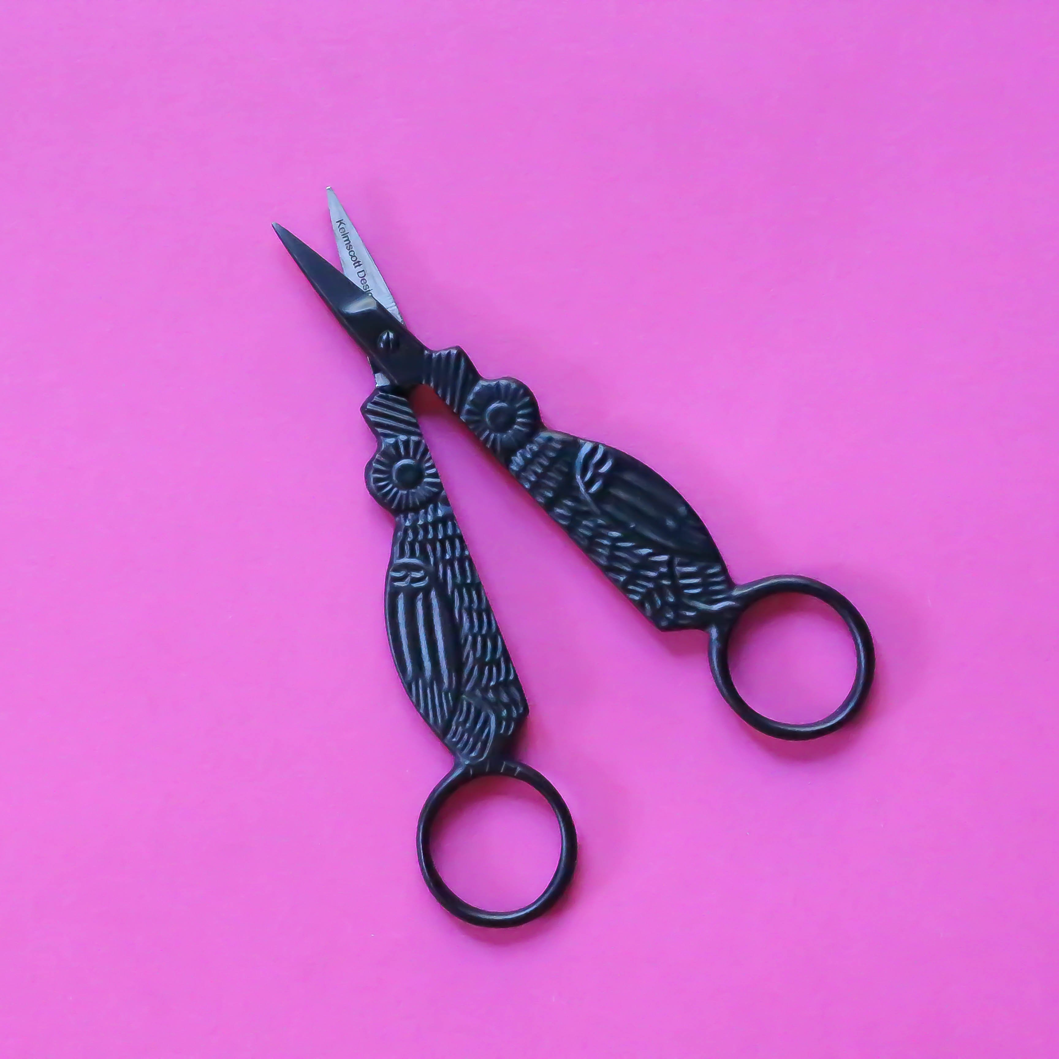 Black Owl Embroidery Scissors open on pink background